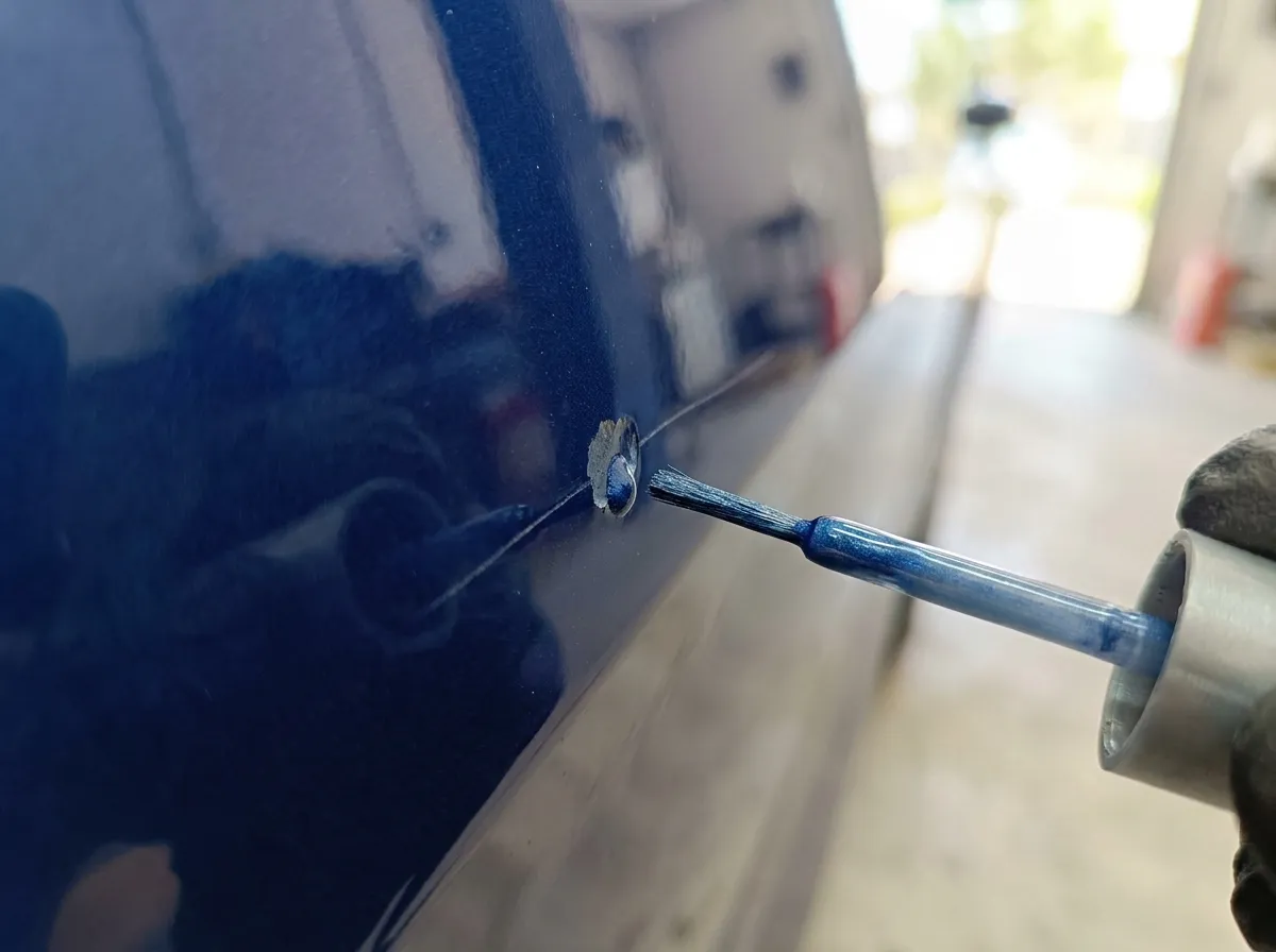 Stone chip and scratch on car paint